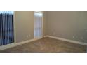An empty bedroom featuring neutral colors, tile floors and bright windows at 5418 Brookswood Way # 100 Brookwood Way # 1008, Orlando, FL 32808