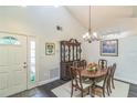 Formal dining room featuring a dining table, hardwood flooring, and bright light at 544 Remington Oak Dr, Lake Mary, FL 32746