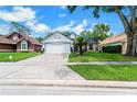 Single story home with a well maintained front yard, driveway and attached garage at 544 Remington Oak Dr, Lake Mary, FL 32746