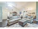 Spacious living room area featuring vaulted ceiling and hardwood flooring at 544 Remington Oak Dr, Lake Mary, FL 32746