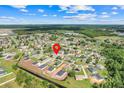Scenic aerial view of the residential neighborhood, surrounded by lush greenery and natural beauty at 560 Viceroy Ct, Kissimmee, FL 34758