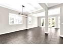 Bright living room with large windows, recessed lighting, and tile flooring at 7710 Linkside Loop, Reunion, FL 34747