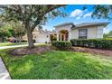 Lovely single-story home with manicured lawn, mature trees, and a two-car garage in a serene setting at 821 Shallow Brook Ave, Winter Springs, FL 32708