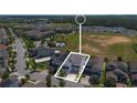 Aerial view of the property in a neighborhood with proximity to an open green space at 9845 Emerald Berry Dr, Winter Garden, FL 34787