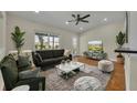 Cozy living room features modern decor, vaulted ceilings, and large windows at 1120 Courtland St, Orlando, FL 32804
