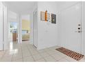 Bright foyer featuring tiled floors and a clear view into the bedroom at 1156 Lucaya Cir, Orlando, FL 32824