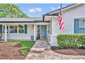 Close up of home featuring brick walkway leading to front door and manicured landscaping at 2450 Mcintosh Way, Maitland, FL 32751