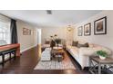 Spacious living room with hardwood floors, decorative rugs, and a comfortable seating arrangement at 2801 Plaza Terrace Dr, Orlando, FL 32803