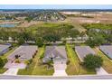 Aerial view of the home highlighting its location in a residential community with easy access to nearby fields at 3755 Sanibel St, Clermont, FL 34711