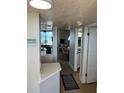 Condo entryway with tiled floor leading to the kitchen and living area with an ocean view at 4453 S Atlantic Ave # 602, Ponce Inlet, FL 32127