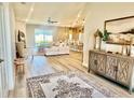 Bright, open-concept living area showcasing modern decor and seamless flow to the kitchen and outdoor space at 6686 Treymont Dr, Lakeland, FL 33813