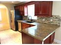 Kitchen showcasing granite countertops, stainless steel appliances and attractive cabinetry at 8613 Edge O Woods Ct, Orlando, FL 32819