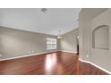 Inviting living room featuring gleaming hardwood floors and neutral color palettes at 9871 Nonacrest Dr, Orlando, FL 32832