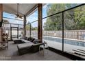 Spacious sunroom features a clear view of the pool, creating a seamless transition to outdoor leisure at 13 Bass Lake Dr, Debary, FL 32713