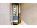 Inviting entryway with a decorative glass door, a 'Welcome' mat, and a cozy 'Home' sign at 200 Summershore Dr, Auburndale, FL 33823