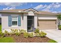Close-up of house front exterior showcasing a well-maintained lawn and partial driveway at 200 Summershore Dr, Auburndale, FL 33823