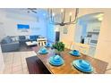 Open concept living and dining area with stylish furnishings and ample natural light at 3129 Arrow Dr, Kissimmee, FL 34746