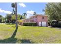 Beautiful home with a well-kept yard and a side entrance garage at 360 W University Ave, Orange City, FL 32763