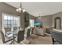 Open-concept living and dining area with sliding glass doors and modern decor at 6404 S Goldenrod Rd # A, Orlando, FL 32822