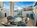 The backyard features a pool, ample seating and privacy from neighbors at 1128 Challenge Dr, Davenport, FL 33896