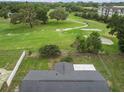 Stunning aerial view showcasing the backyard and the adjacent golf course at 136 Triplet Lake Dr, Casselberry, FL 32707