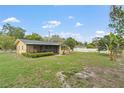 A spacious backyard featuring a screened lanai, perfect for outdoor living and entertaining at 136 Triplet Lake Dr, Casselberry, FL 32707