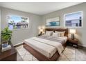 Cozy main bedroom with stylish decor, soft lighting, and two bright windows at 1623 Crestlawn Ave, Orlando, FL 32811