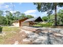 Rear exterior showing the spacious backyard with carport and extra parking for boats or RVs at 175 Cliff St, Deland, FL 32720