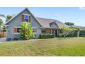 Attractive single-Gathering home with vibrant landscaping and well-maintained lawn at 1880 Lorraine Way, St Cloud, FL 34769
