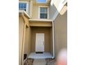Inviting entryway with tiled landing and white front door at 3530 Rodrick Cir, Orlando, FL 32824