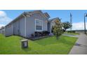 Well maintained home with green lawn and attractive landscaping at 567 Pinecrest Loop, Davenport, FL 33837