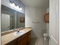 Bright bathroom with a vanity, sink, mirror, and shower-tub combo at 6169 Metrowest Blvd # 102, Orlando, FL 32835