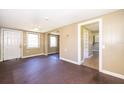A vintage-style living room featuring wood floors, and neutral-toned walls, enhanced by a classic ceiling fan at 1121 Votaw Rd, Apopka, FL 32703