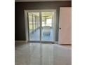 Patio view features a sliding glass door and white cushioned patio furniture at 11373 Darlington Dr, Orlando, FL 32837