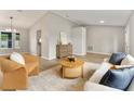 Spacious living room with modern decor, wood flooring, and comfortable seating arrangement at 1195 Tivoli Dr, Deltona, FL 32725