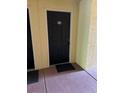 A classic black door with unit number 202, complete with a welcome mat at 1950 Summer Club Dr # 202, Oviedo, FL 32765