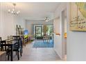 Bright living room with wood floors and sliding glass doors to the outside seating area at 200 Maitland Ave # 19, Altamonte Springs, FL 32701