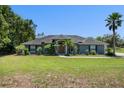 Well-maintained single-story home featuring a spacious front yard and a classic design at 2633 Pickett Downs Dr, Chuluota, FL 32766