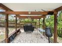 Enjoy outdoor cooking in this covered outdoor kitchen area, perfect for entertaining guests and Gathering at 3054 Bluebrook Dr, Winter Park, FL 32792