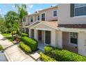 Inviting facade featuring a well-maintained lawn and neutral color palette at 3112 Seaview Castle Dr, Kissimmee, FL 34746