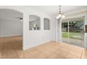 Light-filled dining area with sliding glass door access to outdoor space at 3591 Sandlor Dr, Deltona, FL 32738
