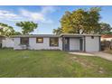 Charming single-story home featuring a well-maintained lawn and a freshly painted exterior at 3927 Citadel Dr, Orlando, FL 32839