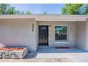 A well-lit front door area showcases stone accents and updated exterior at 4226 Kelly Miller Ct, Orlando, FL 32811