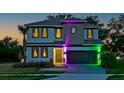 Striking two-story home with custom lighting, landscaping, and a welcoming two-car garage at 4441 Ganesha Loop, Kissimmee, FL 34746