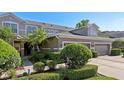 Well-maintained home featuring lush landscaping and an attached two-car garage at 585 Cruz Bay Cir, Winter Springs, FL 32708