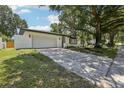Charming one-story home with a two car garage, mature landscaping, and inviting curb appeal at 641 Peachwood Dr, Altamonte Springs, FL 32714