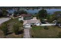 Aerial view of the home showing the lawn and proximity to the lake at 1100 Peak Cir, Deltona, FL 32738