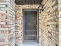 Close-up of the brick facade and front door at 1806 Foxhall Cir # 1806, Kissimmee, FL 34741