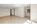 Open-concept living room with tile flooring and neutral paint scheme at 2426 Addison Creek Dr, Kissimmee, FL 34758
