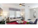 Comfortable living room with natural light and modern decor, perfect for relaxation and entertainment at 2441 Spring Tune Aly, Kissimmee, FL 34744